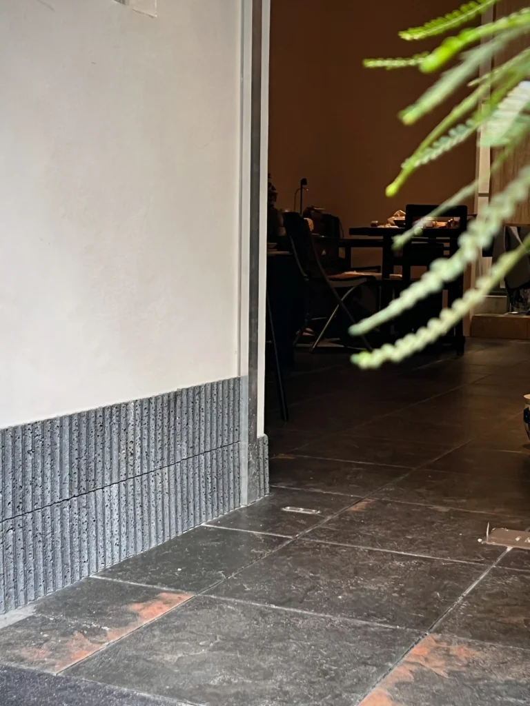 Small Square Black Matte Porcelain Floor Tiles In Doorway