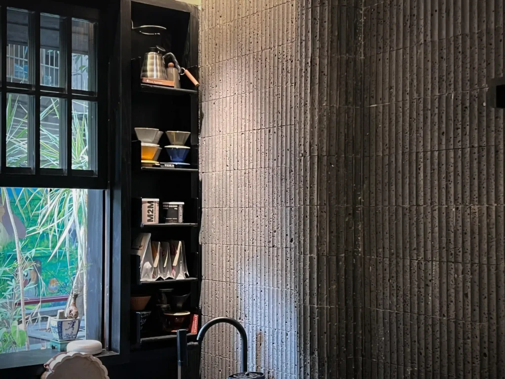 Vertical Fluted Charcoal Wall Tiles In Teahouse Interior